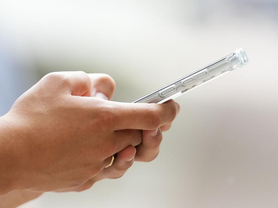 A person uses a cell phone in Ottawa, July 18, 2022. Sean Kilpatrick/The Canadian Press